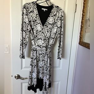 Party dress or night out. Black with white flowers. Belt optional at waist line.